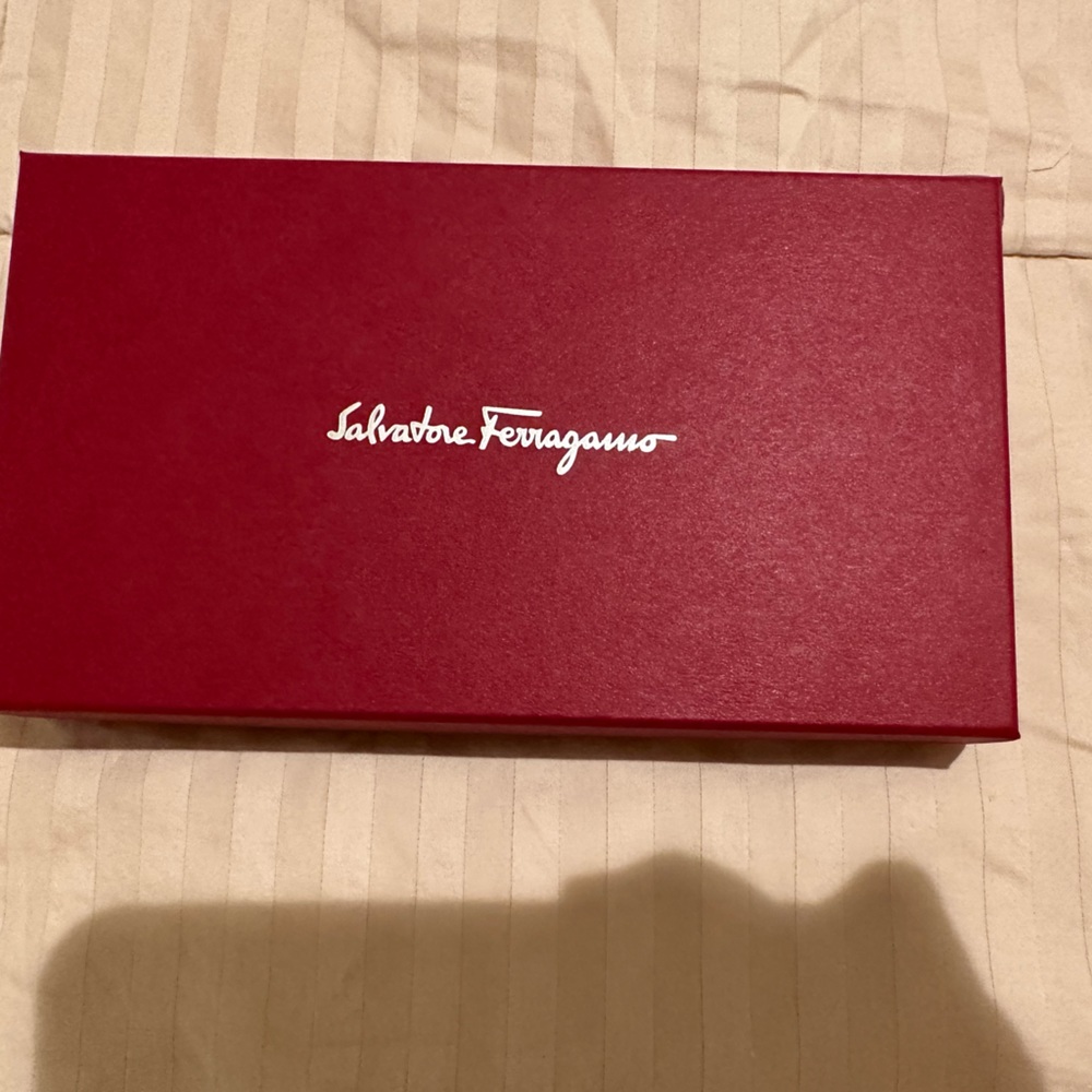 Beautiful Red Ferragamo wallet in pristine condition. Used comes with its box.